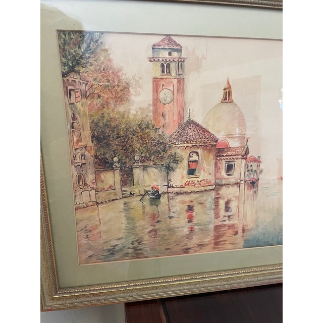 This lovely framed watercolor is of a waterway canal in Venice looking at the dome of Saint Salute. It is signed and dated...