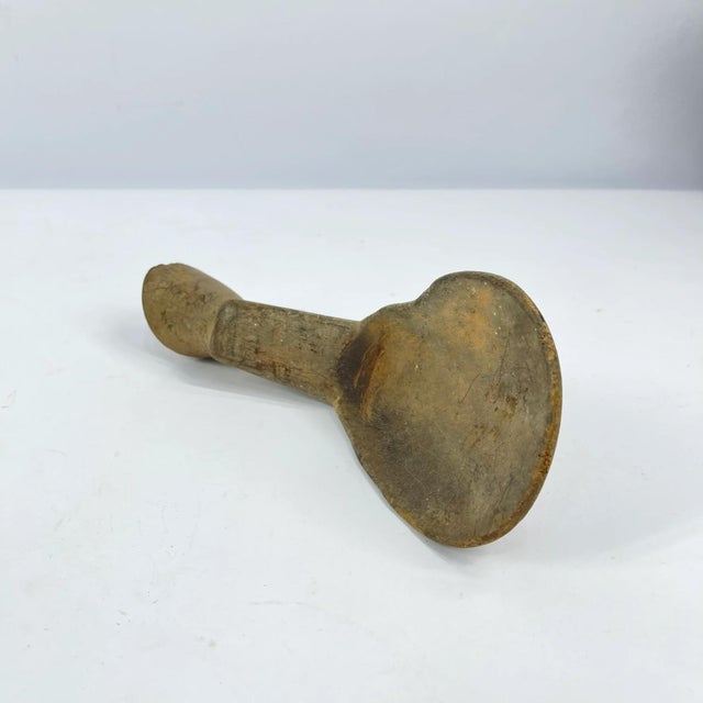 Hand-carved wooden spoon from the Lobi people of West Africa, originating from the border regions of present-day Burkina...