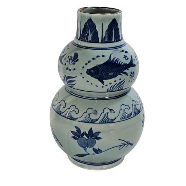Graceful and symbolic, this hand-painted double gourd vase embodies the serene refinement of Chinese scholar art. The...
