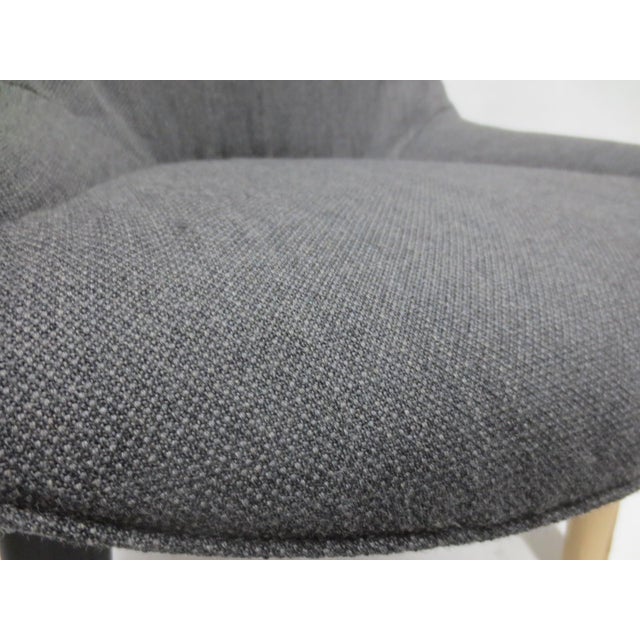 The Walter Knoll Sheru Chair in Grey Fabric is a contemporary and comfortable single-seating option designed for modern...