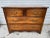 This vintage Hekman chest of drawers showcases classic craftsmanship and timeless design, featuring a warm, rich wood...