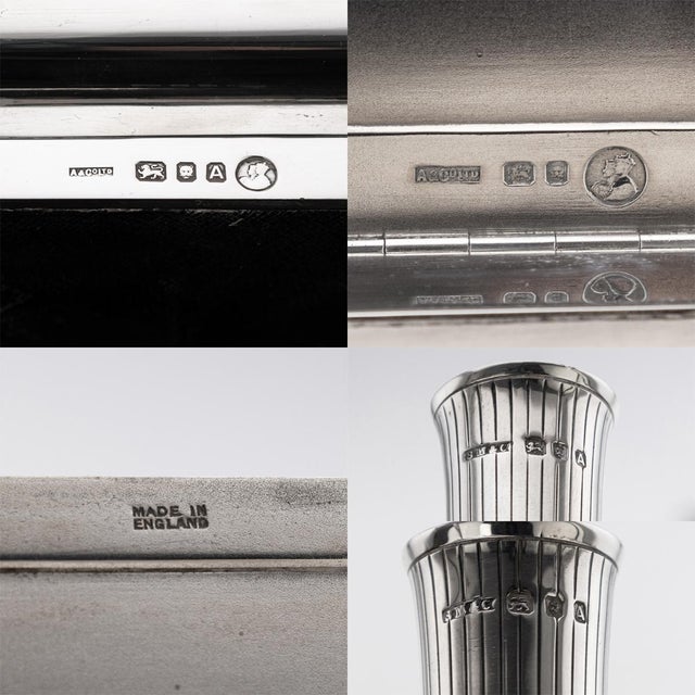 A superb 20th century english solid silver art deco desk set, comprising a mechanical pencil, notepad with paper, two pen...