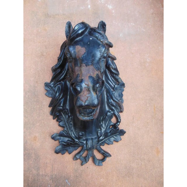 A antique cast iron horse head with excellent detail. The cast iron horse head may have been designed to be mounted on a...