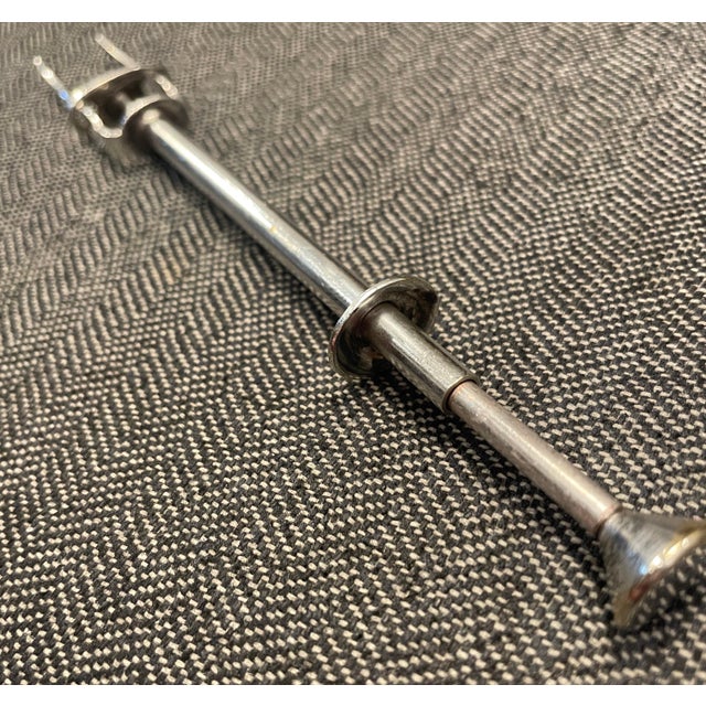 English silver plate mechanical olive pick, manufactured in England and marked on the inside of a prong. Great for your...