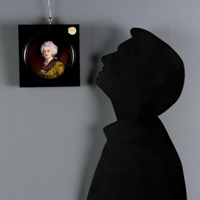 Limoges enamels on a copper plate. The enamels highlight the female figure in an elegant gold dress with a fur collar held...