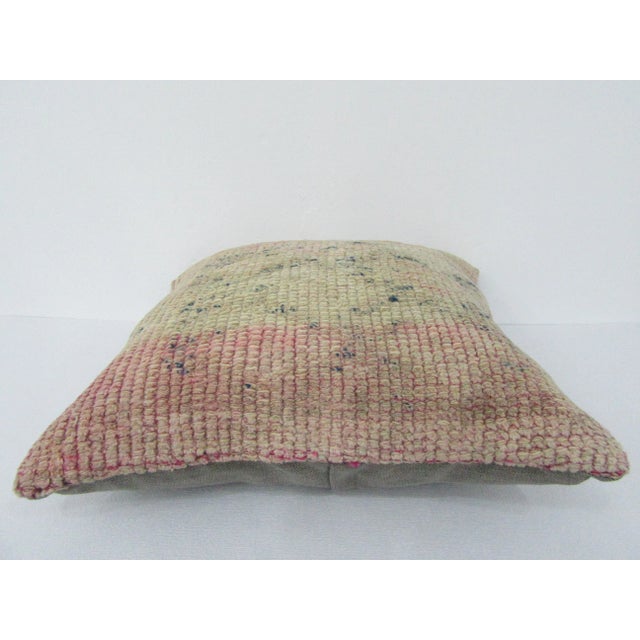 This is a pillow cover made from a vintage kilim rug. The piece was properly washed and ready to use. Pillow inserts not...