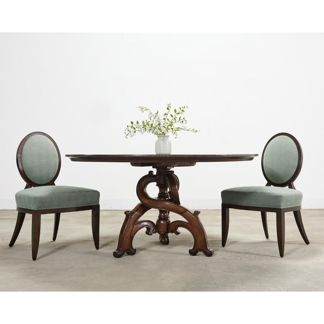 A refined iconic set of six oval X-Back dining side chairs designed by Barbara Barry for Baker Furniture. The chairs...