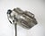 A unique and stunning Art Deco streamline polished aluminum hooded floor lamp with black iron adjustable tri legged base....