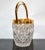 Art Deco Style heavy small Ice Bucket in Lead Crystal with Brass Décor. Note the detail in the Cut Glass patterns,...