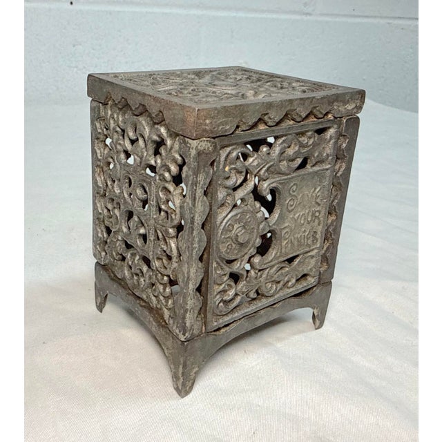 The scarce antique cast iron still penny bank by Kenton Safe is a unique collectible piece originating from the United...