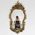 Vintage Baroque Syroco mirror in Hollywood Regency style from the 1960s with a gold resin frame. The mirror was made in...