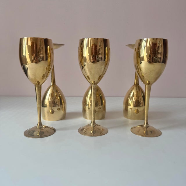 A beautiful set of 6 brass wine goblets with silver plated interior. C.1970's. Dimensions: each goblet measures 8.25"H x...