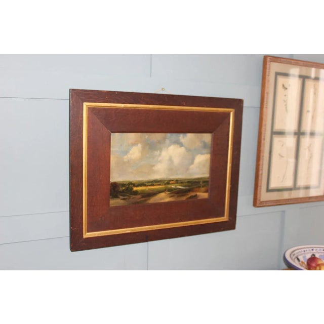 Follower of Andreas Schelfhout Landscape near Haarlem This charming oil-on-paper painting captures a serene landscape near...