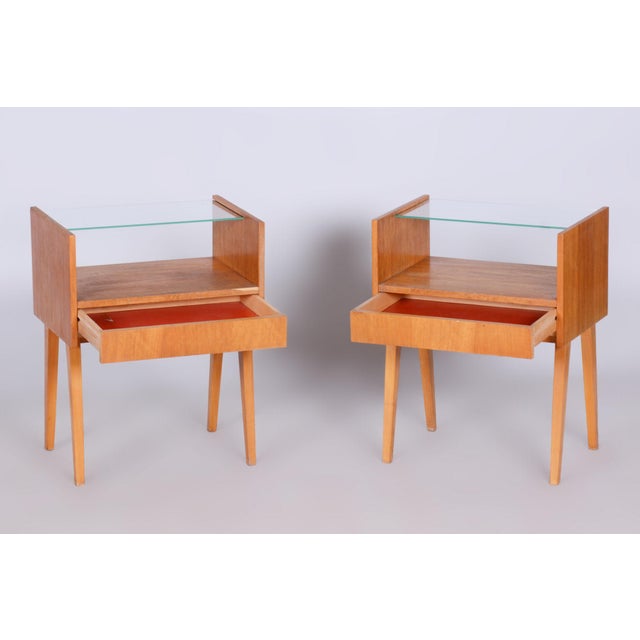 This original pair of bedside tables, originating from the 1950s, represents an exceptional and highly valued example of...