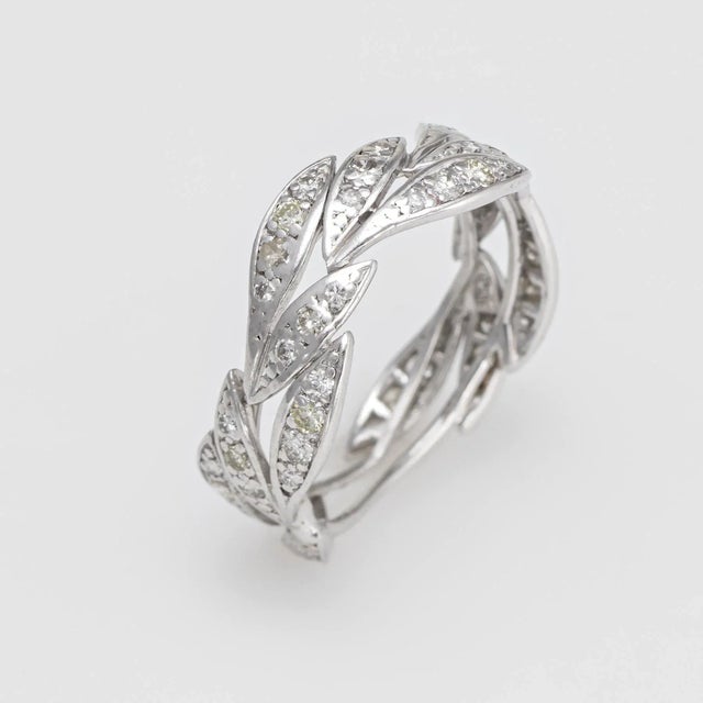 This is part of Chairish's Fine Jewelry assortment. Overview:﻿ A finely detailed vintage diamond eternity ring, crafted in...