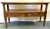 Timeless vintage Hekman Furniture console table from the 1970's. It is made of solid wood in a medium tone finish with a...