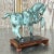 A gorgeous vintage Asian Tang Dynasty horse. A beautiful, patinated green finish on a solid metal horse. Rests on a...