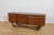This sideboard was manufactured by the British furniture maker Beautility during the 1960s. The piece is distinguished by...