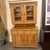 Design Plus Gallery presents an Antique European Pine Two-Piece Hutch Cabinet, Circa 1830. Dating to the early 19th...