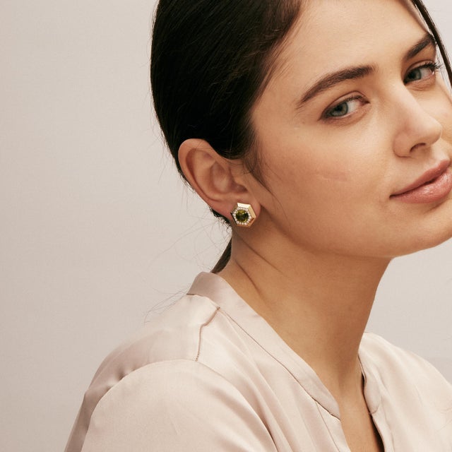 Created in 18 karat yellow gold Peridot 4 carats approx. Diamonds 0.50 carat approx. 18kyg butterfly backs Limited edition...