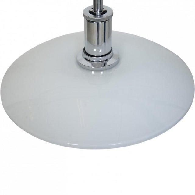 Poul henningsen ph 4½/3½ pendant lamp with white opal glass shades and a chrome aluminium socket housing. The lamp is from...