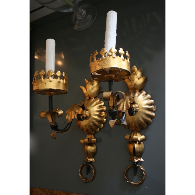 Pair of beautiful vintage Italian wall sconces. Fabulous Hollywood Regency style with artful embellishments on the wall...