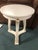 The Covington Drinks Table by Modern History Home is a handcrafted accent piece featuring a polished white slat marble...