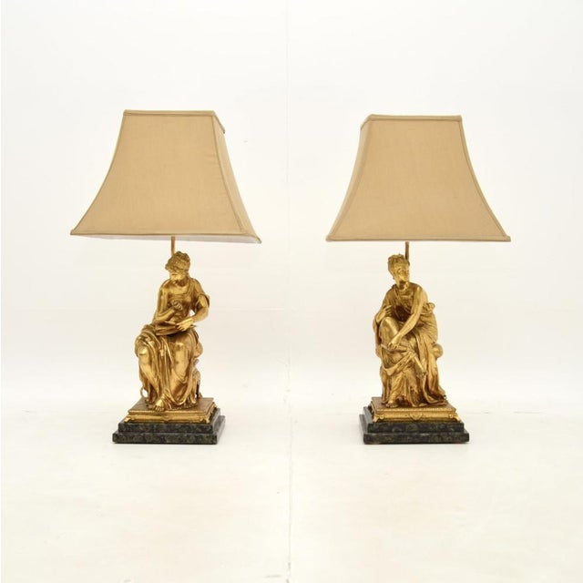 An absolutely stunning pair of antique Victorian gilt bronze table lamps. They were made in England, they date from around...