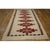 This is an exceptional and highly authentic early 20th-century American Navajo carpet, dating back to circa 1930. Spanning...