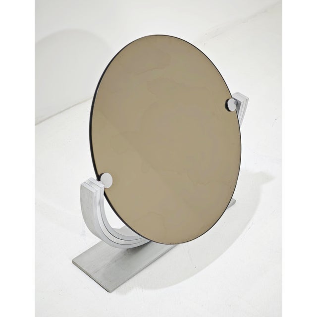 This tilting table mirror is a stunning example of mid-century modern design, combining functionality with an elegant,...