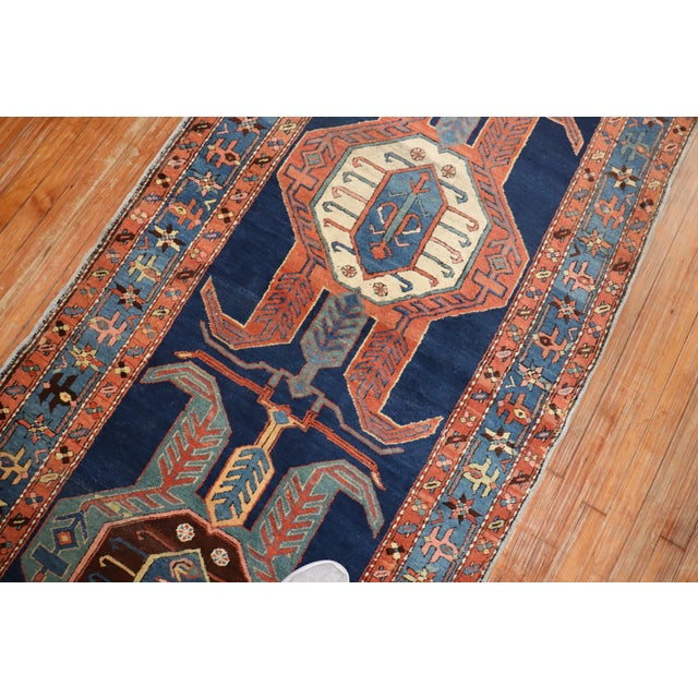 Late 19th century northwest Persian Heriz Serapi long runner. A blue field with a tribal geometric pattern throughout in...