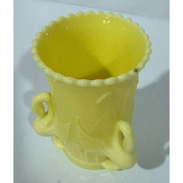 Stunning yellow milk glass vase decorated with swans and cattails. English registry mark dates it to August 14, 1879. This...