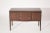 An outstanding console table executed in mahogany with brass hardware, three drawers, and side doors provide plenty of...