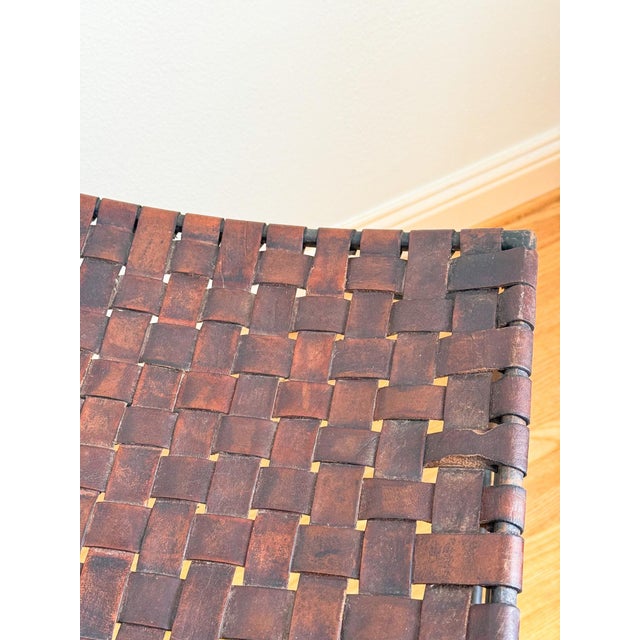Fabulous pair of woven leather and iron bar stools, in the manner of Lila Swift and Donald Monell, believed to be circa...