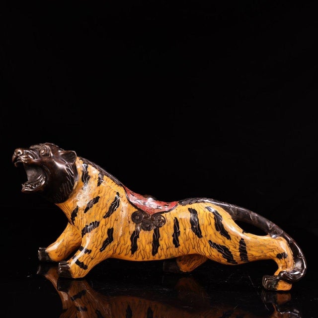 This striking vintage cloisonne enamel figurine depicts a tiger, a traditional symbol of power, courage, and protection....