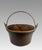 A large heavy gauge nineteenth century solid copper bucket, cauldron, pail or kettle with a rolled rim and iron handle....