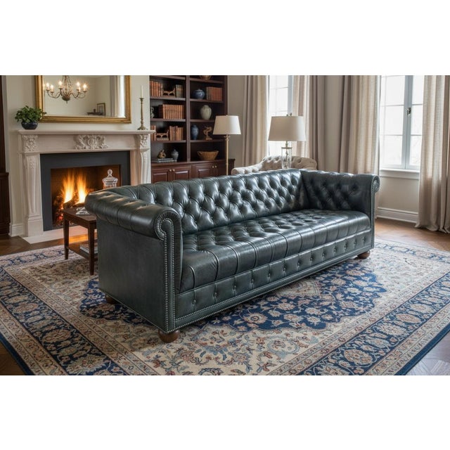 This classic English Traditional design. Upholstered in distressed olive green leather with a rich vintage patina, the...