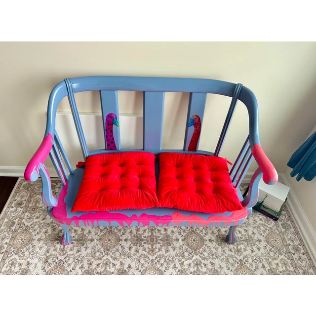 One of a kind hand painted accent loveseat refinished in a bold contemporary palette of soft blue and vibrant pink. This...