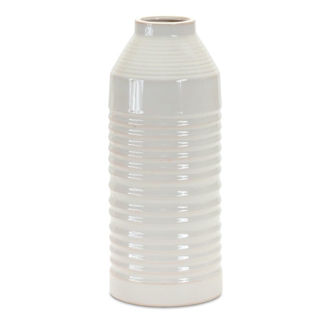 Elevate your home decor with the stylish and timeless design of the Modern Ribbed Terra Cotta Vase. Standing at 14 inches...