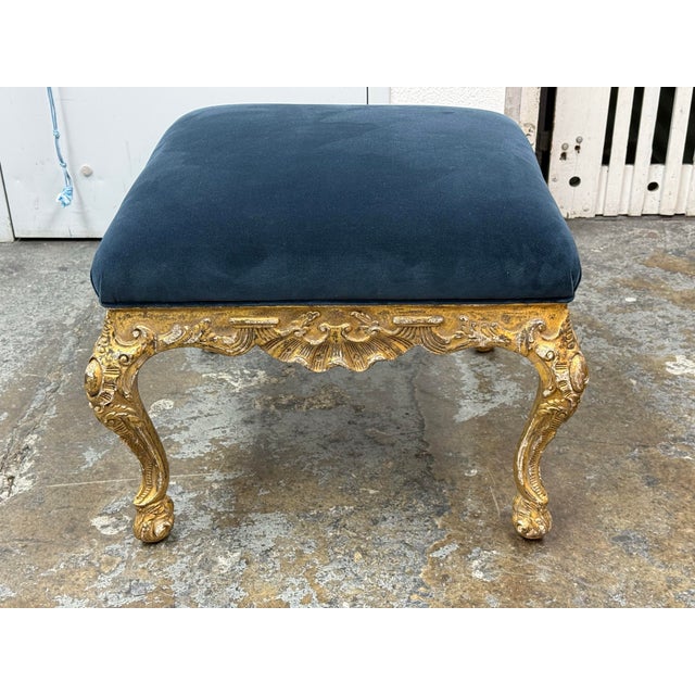 Design Plus Gallery presents a Louis XV-style Giltwood Footstool/Ottoman. The ornate frame showcases carved scrolling...