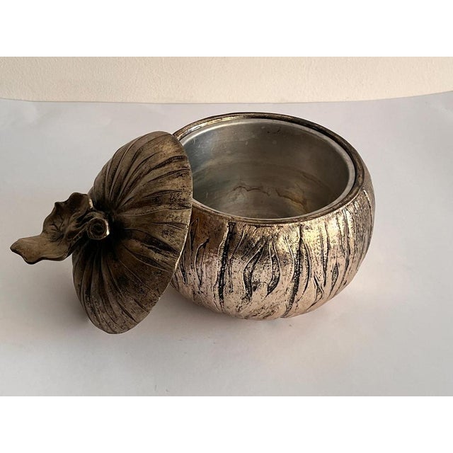 A rare and captivating pumpkin-shaped ice bucket, created by renowned designer Mauro Manetti for the Fonderia d'Arte in...