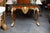 Handsomely designed yew wood Regency style console, the tessellated inlaid top with gilt beaded molding over a prominent...