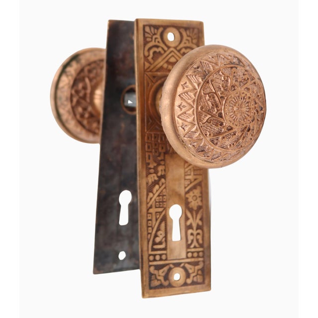 Antique Vernacular style brass door knob set made by Reading in the 1897 catalog. It is part of the K-23800 Windsor group....