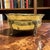 Vintage large footed brass cachepot. Features include a rope design under a hand styled scalloped edge all resting on...