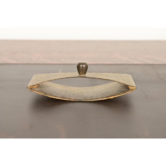 A gorgeous Arts & Crafts period brass finished hand hammered copper rocker ink blotter By Roycroft (signed with impressed...