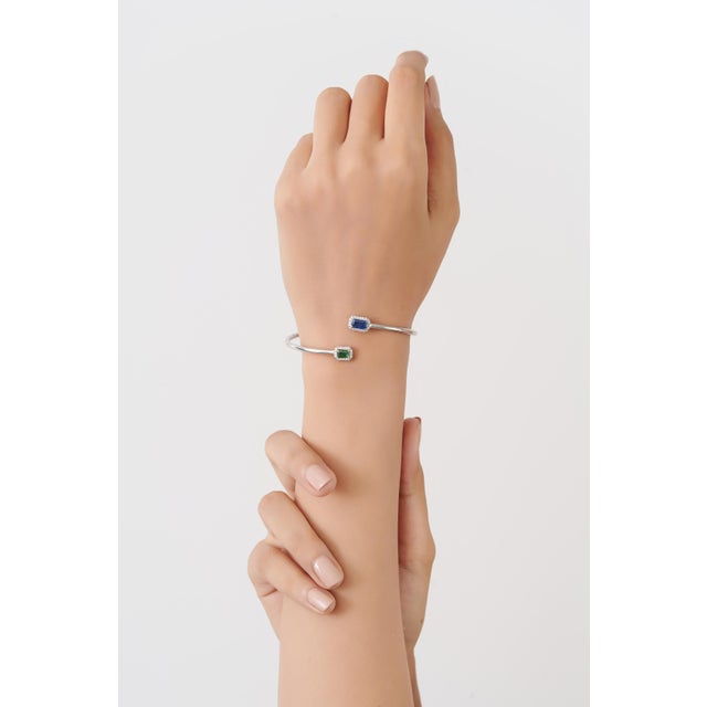 Emerald & Blue Sapphire Toi et Moi Open Cuff Bangle in 925 Sterling Silver is an elegant statement piece featuring 0.92...