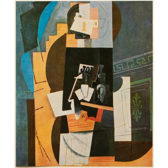An excellent period full-color print after Cubist painting "Joueur de Cartes" (Card Player, 1913-1914) by Pablo Picasso....