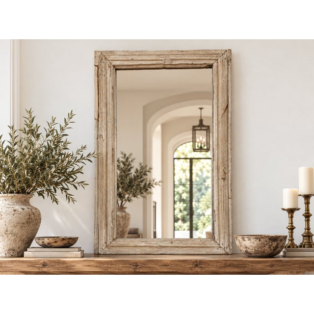 This antique mirror carries the memory of the sun. Sourced from the architectural framework of historic buildings, this...