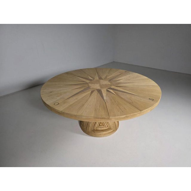 Rare “rosa dei venti” dining table, designed by mario ceroli for poltronova in the 1970s. Executed in solid pine with...