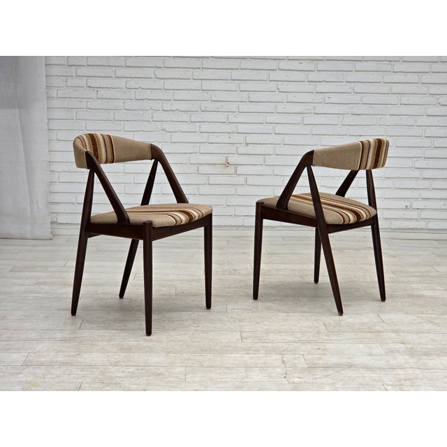 1960s, Danish design by Kai Kristensen, model 31. Pair of armchairs. Original beige/brown furniture wool, dark oak wood....